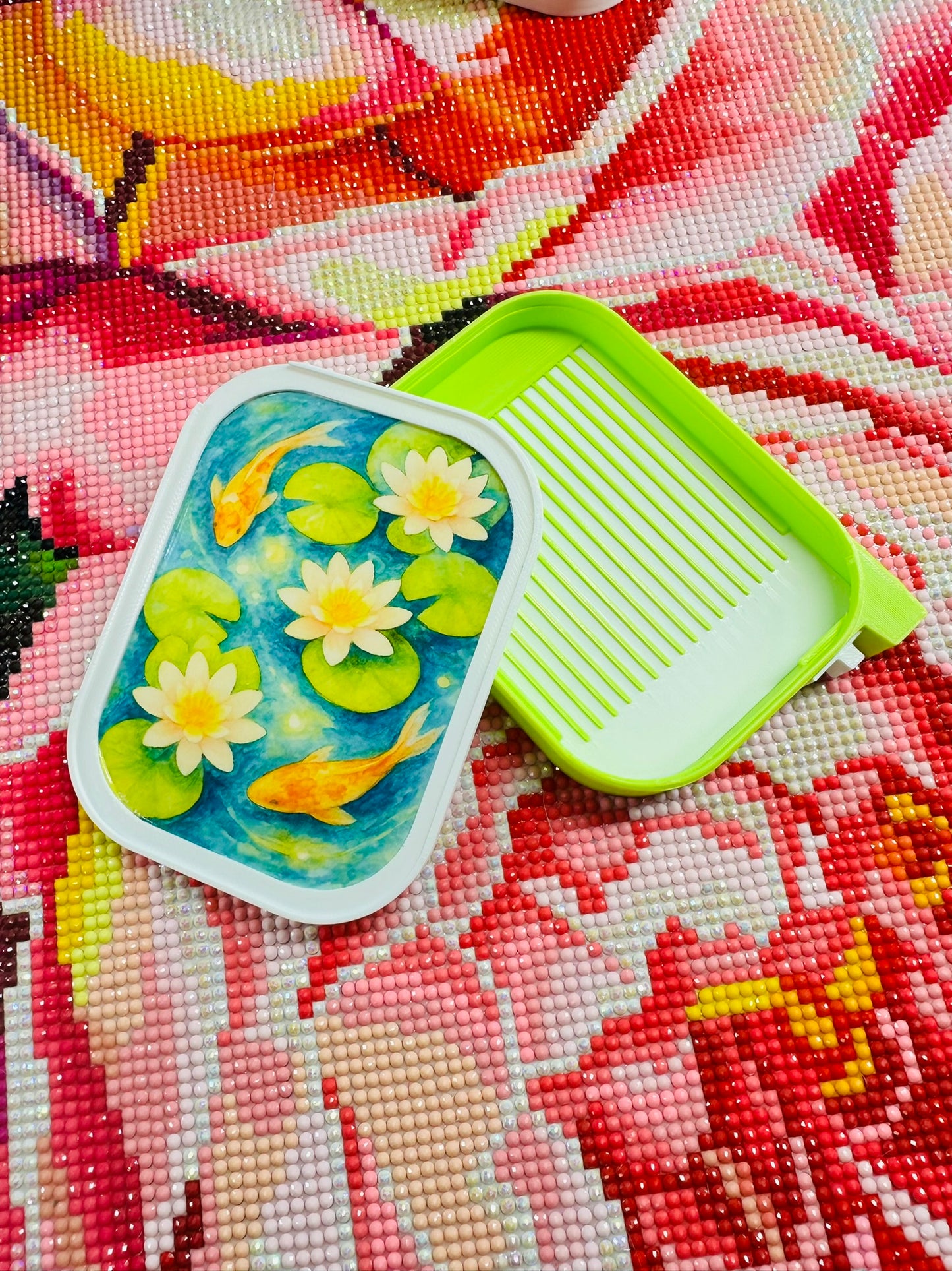 Handmade stackable diamond painting tray with watercolor koi fish design, featuring built-in slider and lid from Artesian Premium collection