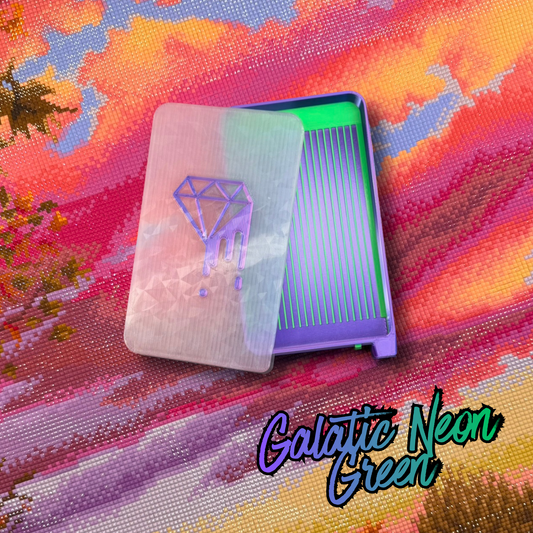 A rectangular tray with a translucent lid featuring a purple diamond graphic, shown on a colorful abstract background. The product is labeled 'Galactic Neon Green' in stylized text at the bottom right.