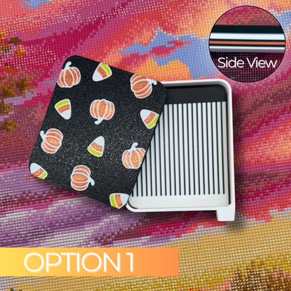 Pumpkin Candy Corn Diamond Art Tray, Option 1, featuring a white 3D printed drill tray with black grooves and a black sliding lid decorated with orange pumpkins and candy corn. A side-view inset shows the layered black, white, and orange tray colors.